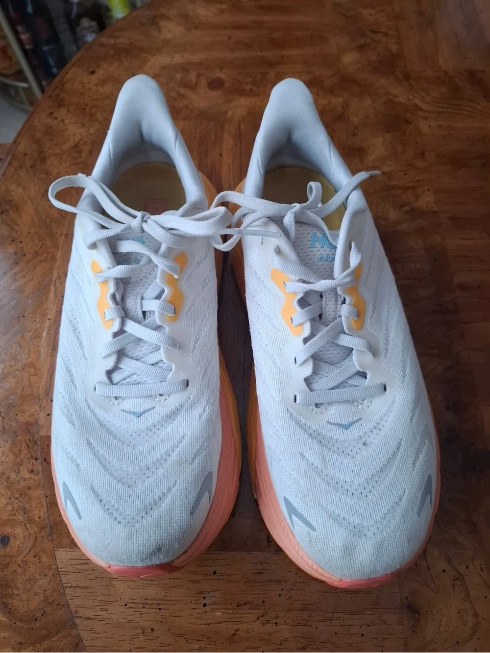 Hoka Women's White Running Shoes with Peach and Yellow Gradient Sole